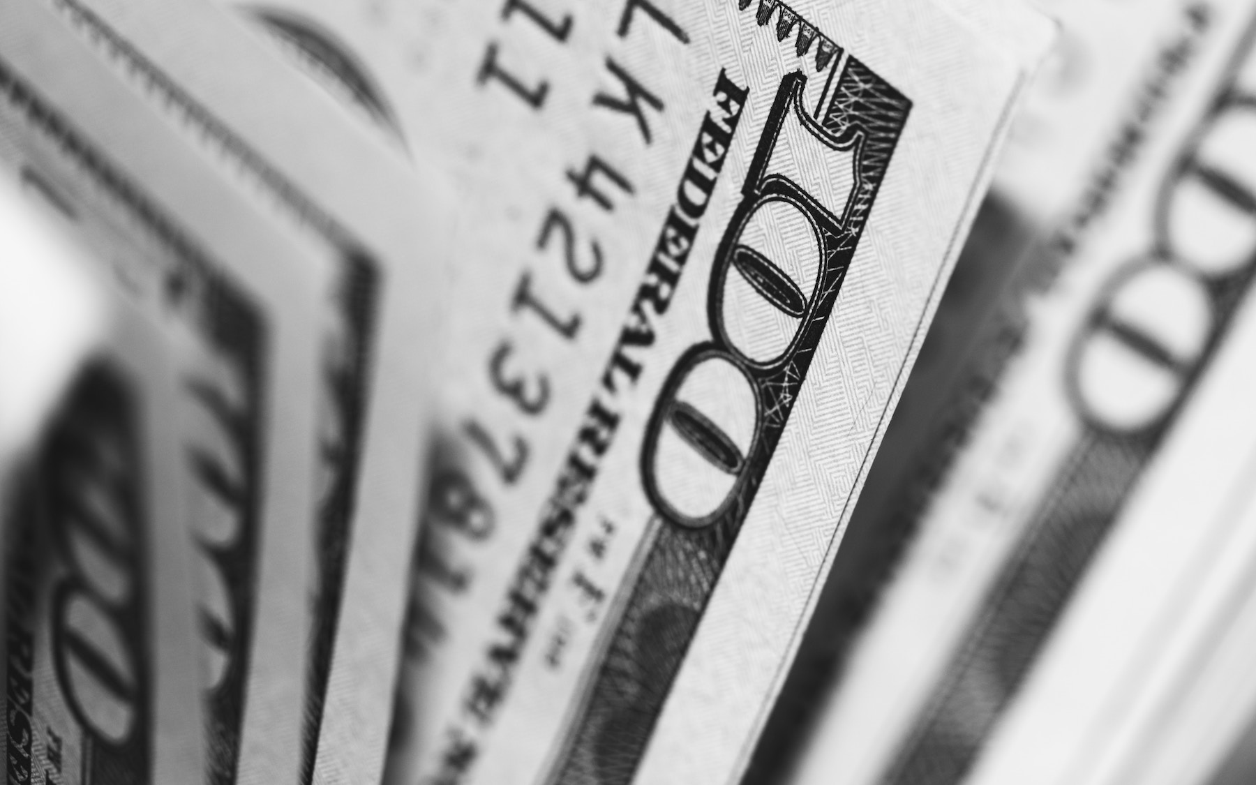 Photo of one hundred dollar bills.
