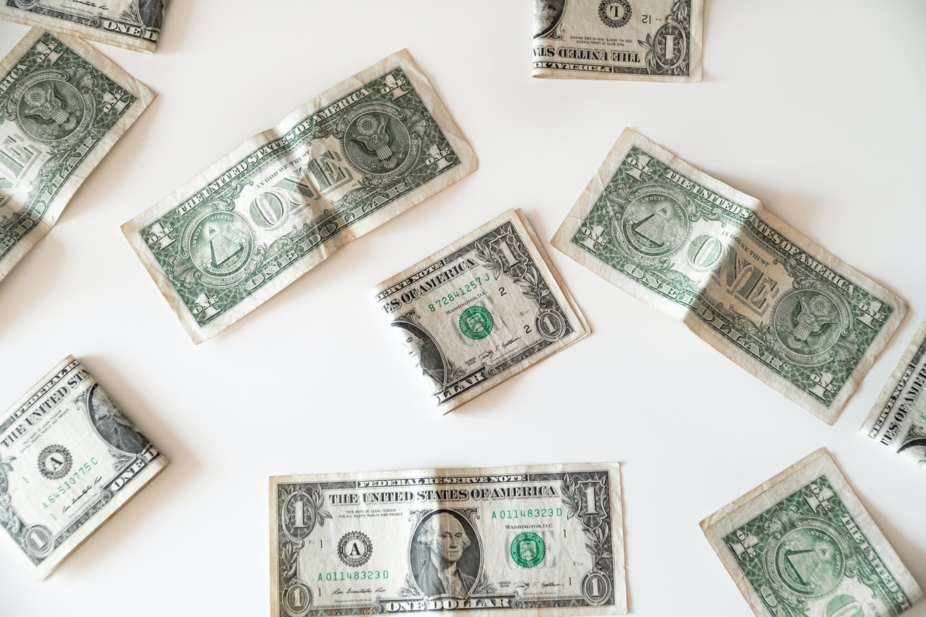 A photo of ten-dollar bills strewn about.