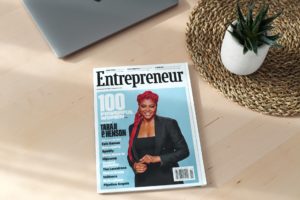 Image of a tabletop as viewed from above with an Entrepreneur magazine on it.