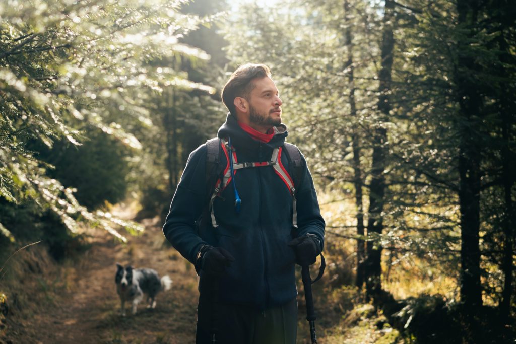 Man paused his hiking on a cool sunny morning